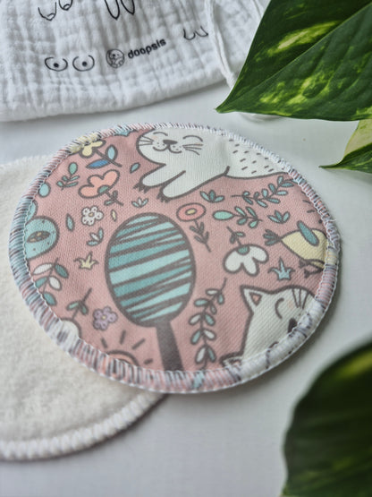nursing pad with nature-themed design on a white fabric background