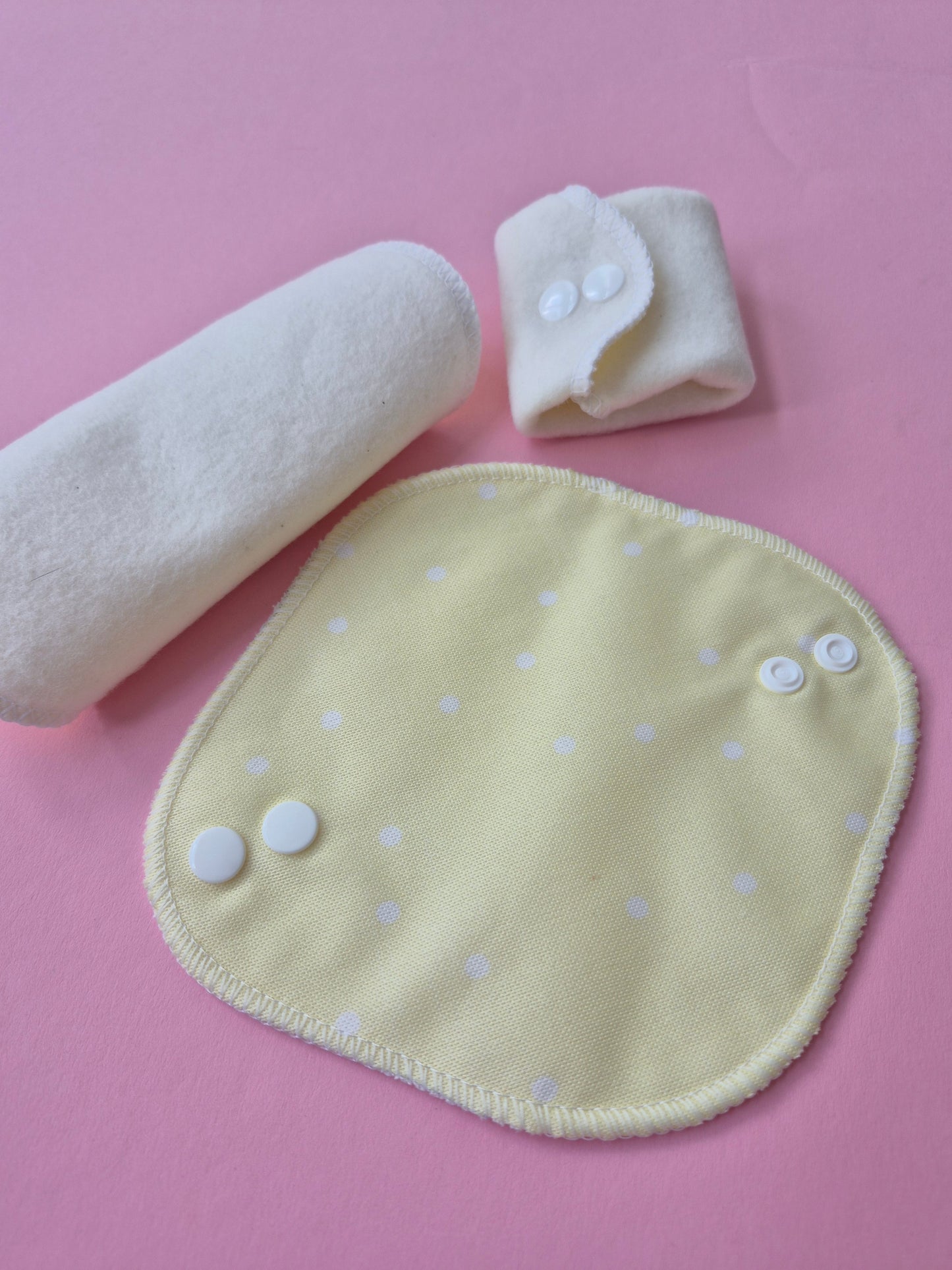 reusable panty liners on pink bacground