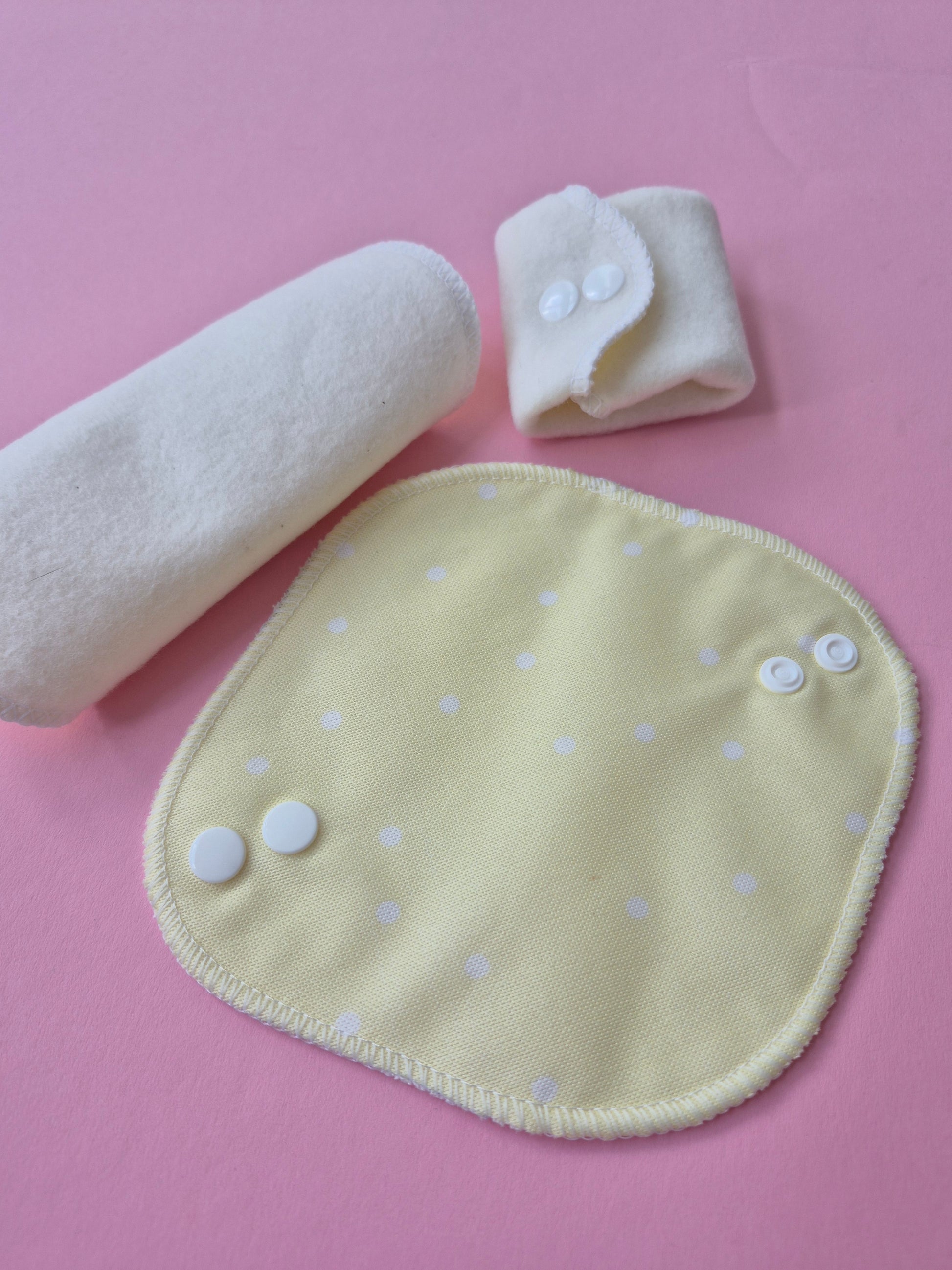 reusable panty liners on pink bacground